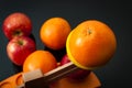 The idiom, comparing apples and oranges, refers to the differences between incomparable or incommensurable items. The concept is Royalty Free Stock Photo