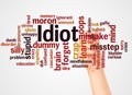 Idiot word cloud and hand with marker concept Royalty Free Stock Photo