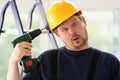 Idiot worker using electric drill portrait Royalty Free Stock Photo