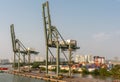 2 idle cranes at port Vict on Song Sai Gon River, Ho Chi Minh City, Vietnam