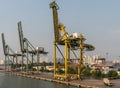 3 idle cranes at port Vict on Song Sai Gon River, Ho Chi Minh City, Vietnam