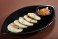 masala idli. savoury rice cake.masala idli with chatni. Royalty Free Stock Photo