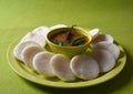 Idli with Sambar in bowl on green background, Indian Dish Royalty Free Stock Photo