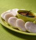 Idli with Sambar in bowl on green background, Indian Dish Royalty Free Stock Photo