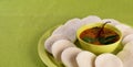 Idli with Sambar in bowl on green background, Indian Dish Royalty Free Stock Photo