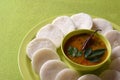 Idli with Sambar in bowl on green background, Indian Dish Royalty Free Stock Photo