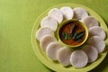 Idli with Sambar in bowl on green background, Indian Dish Royalty Free Stock Photo