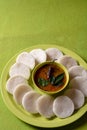 Idli with Sambar in bowl on green background, Indian Dish Royalty Free Stock Photo