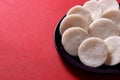 Idli with Sambar in bowl on red background, Indian Dish Royalty Free Stock Photo