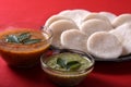 Idli with Sambar in bowl on red background, Indian Dish Royalty Free Stock Photo