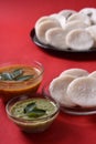 Idli with Sambar in bowl on red background, Indian Dish Royalty Free Stock Photo