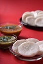 Idli with Sambar in bowl on red background, Indian Dish Royalty Free Stock Photo