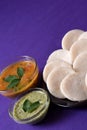 Idli with Sambar and coconut chutney on violet background, Indian Dish Royalty Free Stock Photo