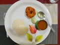 Idli and vada ,  a common healthy south Indian dish is served with sambar and spoon Royalty Free Stock Photo