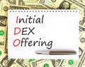 IDO initial DEX offering symbol. Concept words IDO initial DEX offering on beautiful white note. Dollar bills. Beautiful dollar