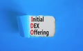 IDO initial DEX offering symbol. Concept words IDO initial DEX offering on beautiful white paper. Beautiful blue paper background