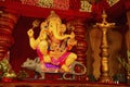 An idol of Lord Ganesha, sitting on his vehicle - a mouse, Guruji Talim Mandal, Pune, Maharashtra, India.