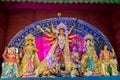 Idols of Hindu Goddess Maa Durga with her childrens in a pandal beautifully decorated during the Durga Puja festival Royalty Free Stock Photo