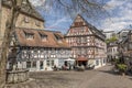 people enjoy sitting outside at old historic market place in Idstein with beautiful half timbered houses