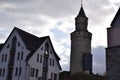 Idstein, Germany - 02 04 2023: Edge of old town wiht Hexenturm next to a modern building Royalty Free Stock Photo