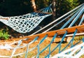 Idylic scene of hammocks in summer sun rays.