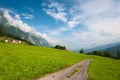 Idyllic Alpine meadow with road. Switzerland