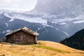 Wooden cottage in dolomities alps Italy