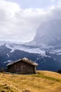 Wooden cottage in dolomities alps Italy