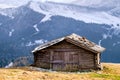 Wooden cottage in dolomities alps Italy