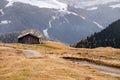 Wooden cottage in dolomities alps Italy