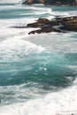 Idyllic and amazing seaside landscape of jagged coast with rocks and rushing white ocean waves Royalty Free Stock Photo