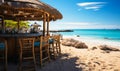 Idyllic beach bar with stools and umbrellas on sandy shore offering a tranquil place for relaxation and socializing with a view of