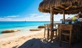 Idyllic beach bar with stools and umbrellas on sandy shore offering a tranquil place for relaxation and socializing with a view of