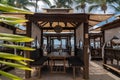 Idyllic beach restaurant with wooden tables and benches and white umbrellas