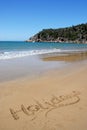 Holidays, word written in beach sand