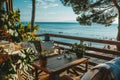 Idyllic Beachside Cafe Terrace Overlooking Serene Ocean Horizon Royalty Free Stock Photo