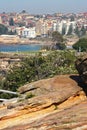 Hillside town on waterfront. Scenic and spectacular landscape with vegetation and rocky coastline by sea in Sydney, Australia