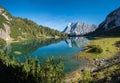 Idyllic blue-green lake Seebensee, with view to Zugspitze mountain and water reflection