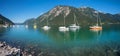 Idyllic blue lake Achensee with moored sailboats