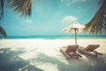 Beautiful vintage tropical island scenery, two sun beds, loungers, umbrella under palm tree. White sand, sea view with horizon Royalty Free Stock Photo