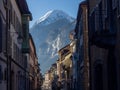 Idyllic city street in Saint Maurice, Switzerland is framed by the majestic backdrop of the Alps.
