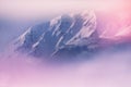 Idyllic cloudy sunrise in the winter mountains with snow ridge. Royalty Free Stock Photo