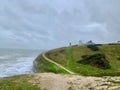 Idyllic coastal landscape Swanage in Dorset and cliff view through a window with drops on glass, part of the Jurassic coast in Dor Royalty Free Stock Photo