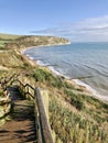 Idyllic coastal landscape Swanage in Dorset and cliff view through a window with drops on glass, part of the Jurassic coast in Dor Royalty Free Stock Photo