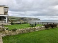 Idyllic coastal landscape Swanage in Dorset and cliff view through a window with drops on glass, part of the Jurassic coast in Dor Royalty Free Stock Photo