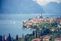 Idyllic coastline scenery in Italy: Blue water and a cute village at lago di garda, Malcesine Royalty Free Stock Photo