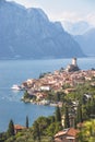 Idyllic coastline scenery in Italy: Blue water and a cute village at lago di garda, Malcesine Royalty Free Stock Photo