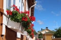 Idyllic colorful wooden house with flowers in the old town Royalty Free Stock Photo