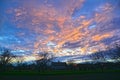 Idyllic countryside sunset with a tree and the house