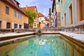 Idyllic Germany. Colorful street and fountain in medieval German town of Rothenburg ob der Tauber view